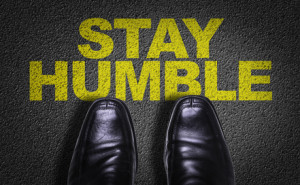 Top View of Business Shoes on the floor with the text: Stay Humble