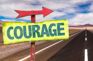 Courage sign with road background