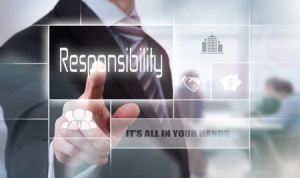 Businessman pressing an Responsibility concept button.